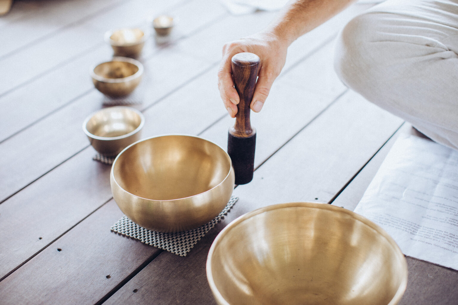 Singing bowls laid out for a recovery session