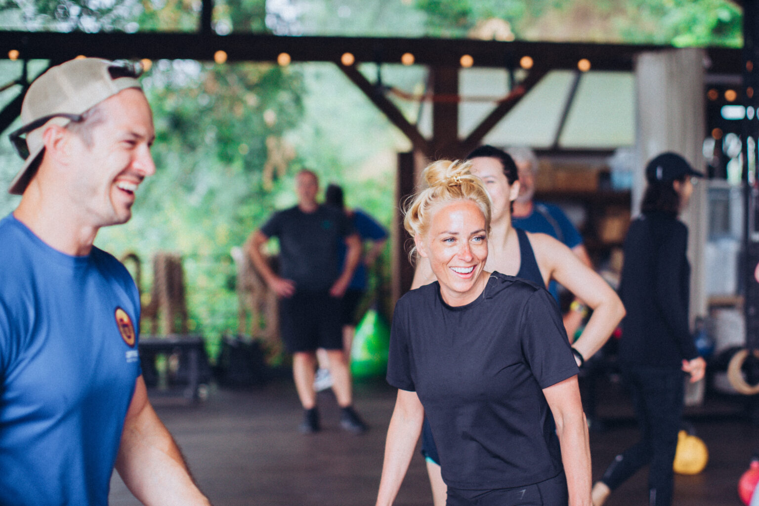 Guests laughing during a group training session